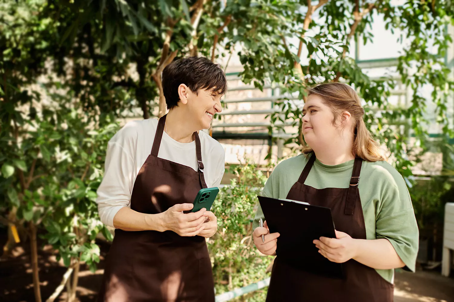 A young woman with down syndrome is learning about her new job with her care provider